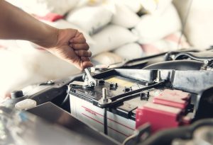 Car service ,fitting a car battery with wrench | Vancouver, WA