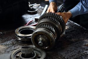 Mechanic holding car transmission in their hands | Vancouver, WA