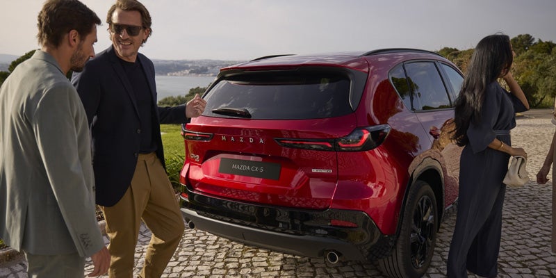 People behind the rear of a 2026 Mazda CX-5