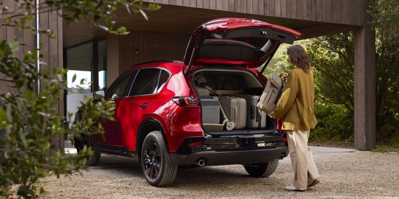Woman loads groceries into a 2026 Mazda CX-5